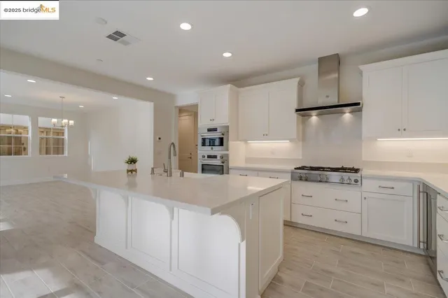 a view of a bathroom with dual sinks