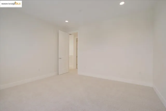 a bedroom with a bed and a mirror