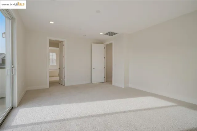 a white bath tub sitting next to a shower