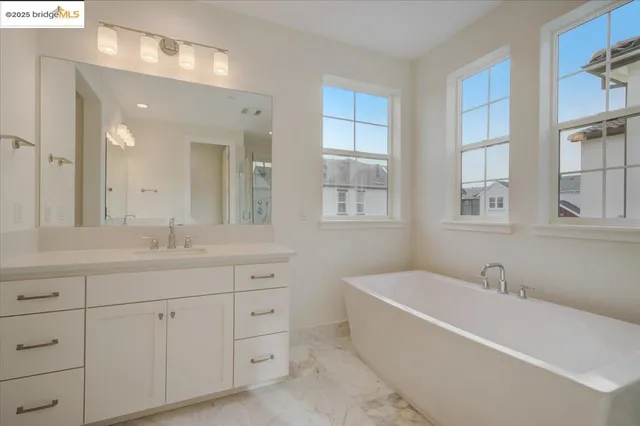 a view of a house with a backyard and sitting area