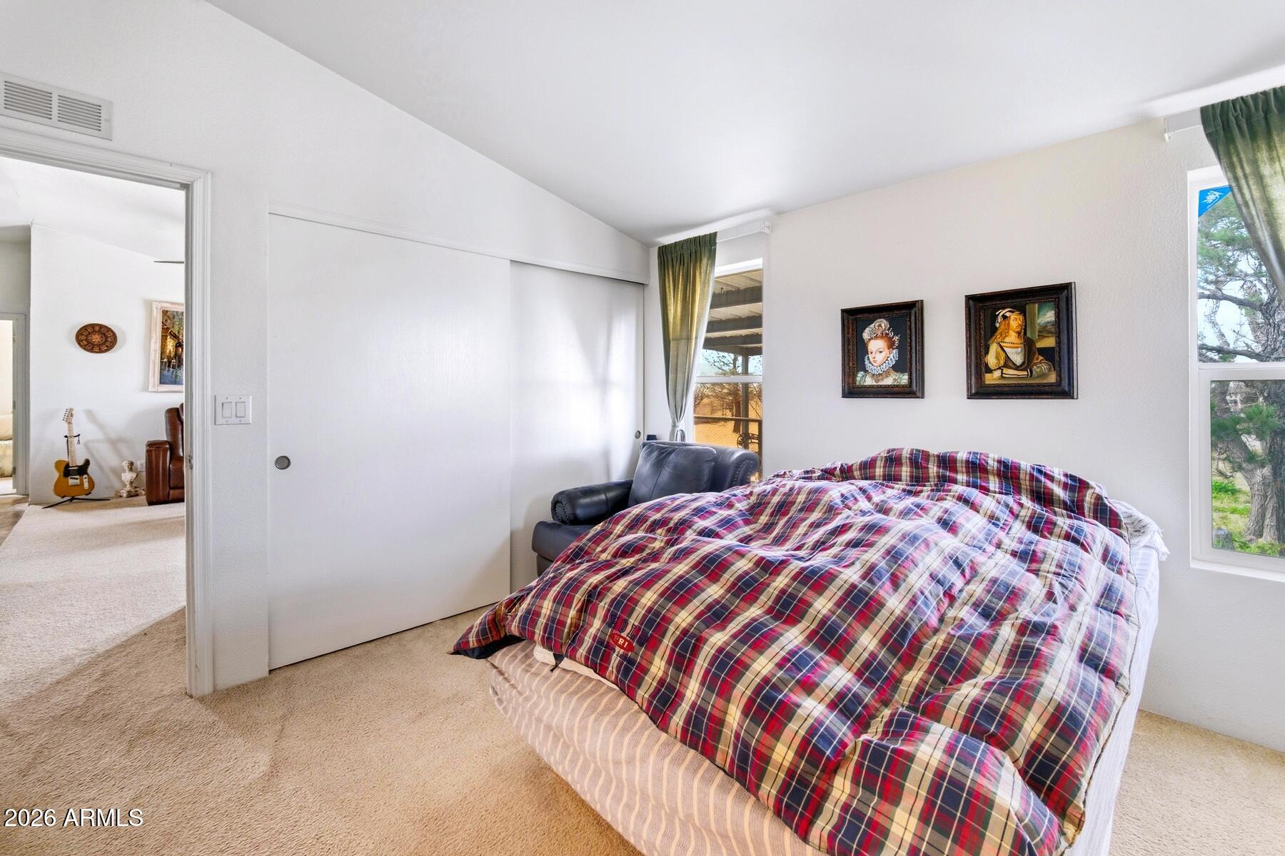 1250 North Fort Grant Road Willcox, AZ 85643 - Photo 16 of 33 a bedroom with a bed and a painting on the wall