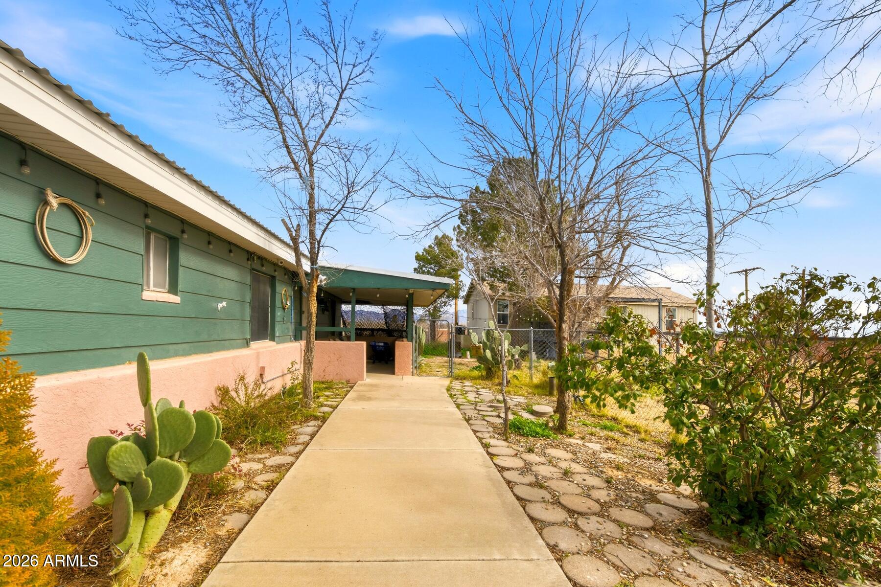 1250 North Fort Grant Road Willcox, AZ 85643 - Photo 22 of 33 a front view of a house with a yard