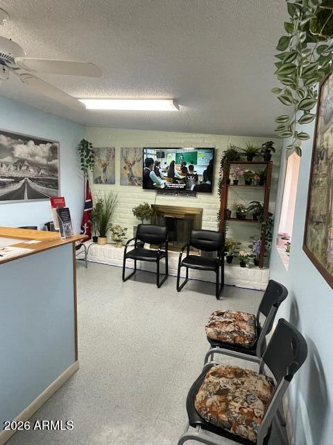 1250 North Fort Grant Road Willcox, AZ 85643 - Photo 24 of 33 a living room with furniture a rug and a wall painting