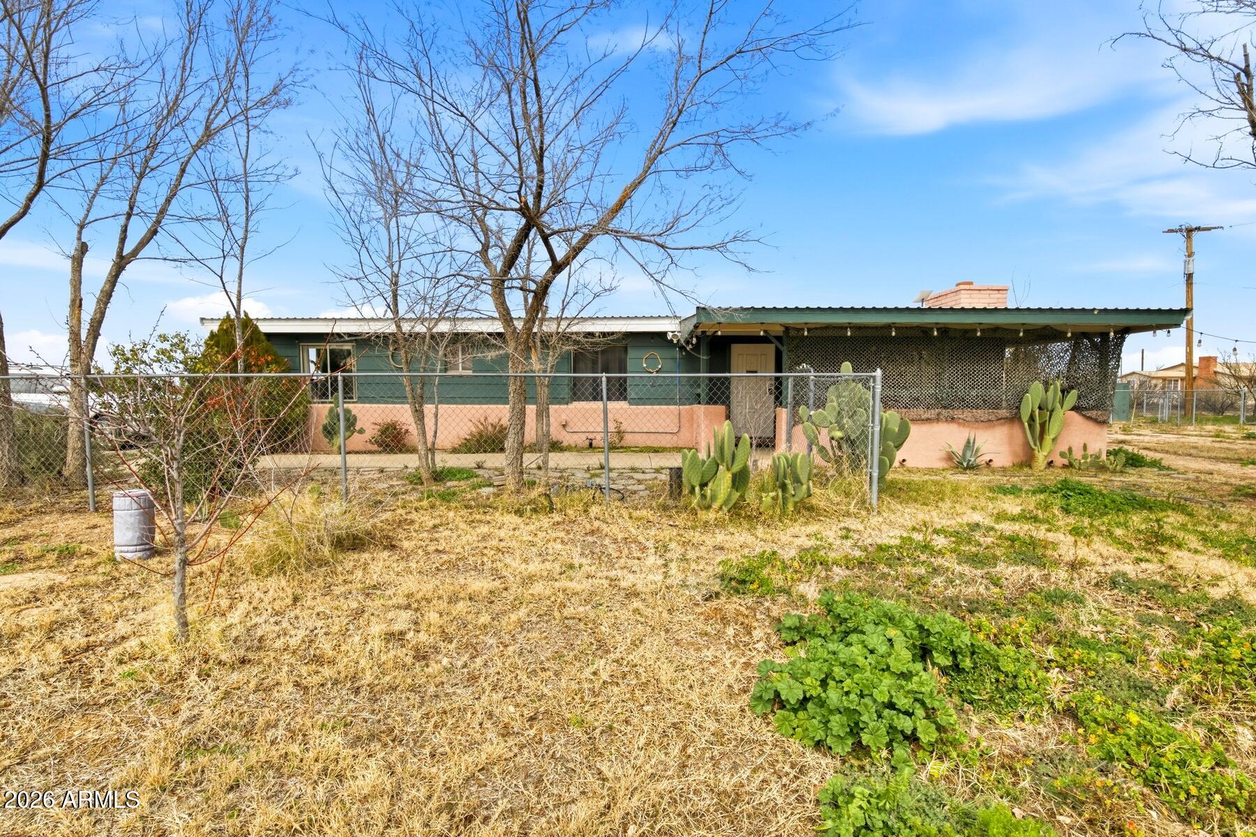 1250 North Fort Grant Road Willcox, AZ 85643 - Photo 4 of 33 a view of a house with a yard