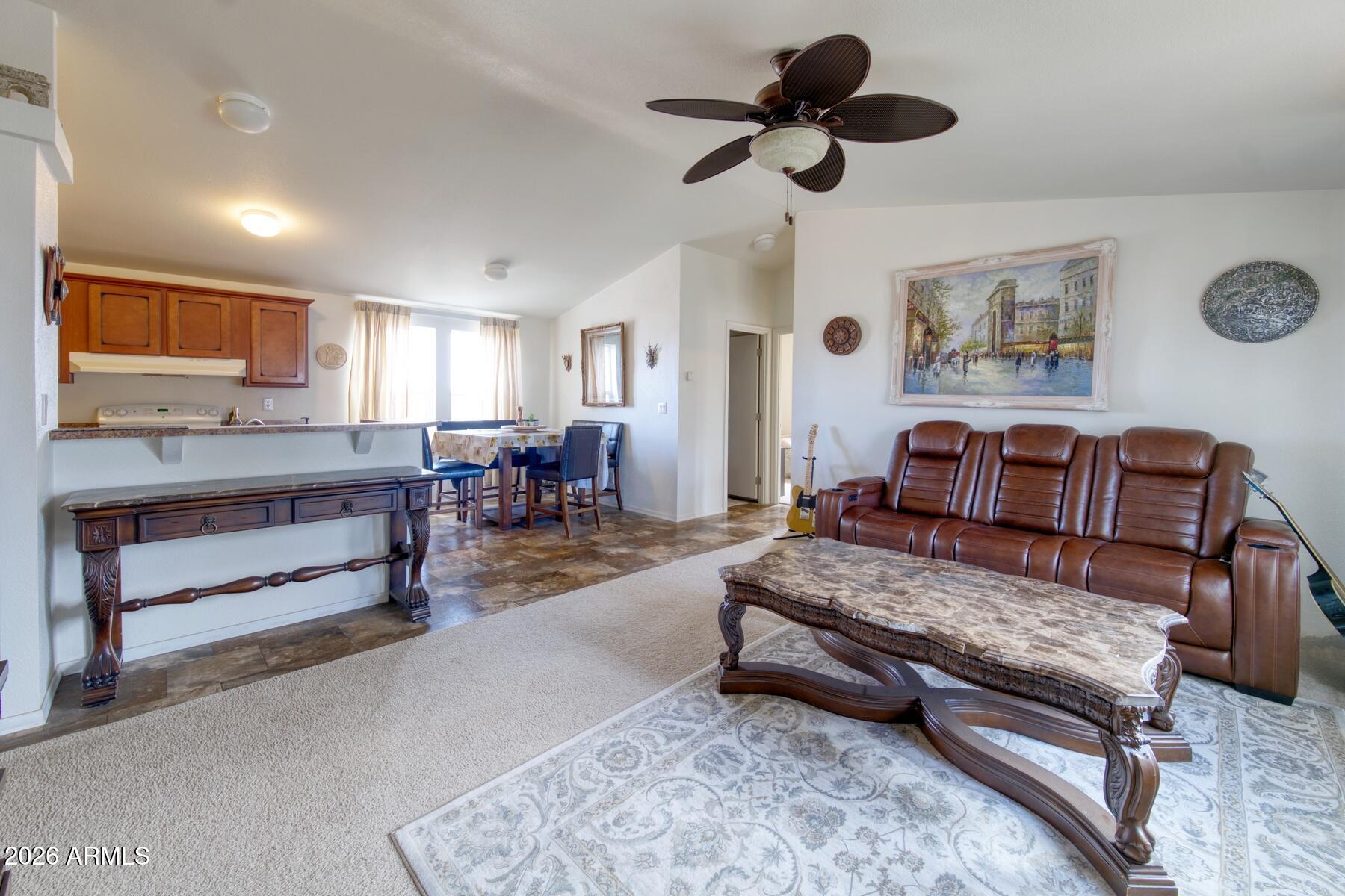 1250 North Fort Grant Road Willcox, AZ 85643 - Photo 8 of 33 a living room with furniture and a ceiling fan