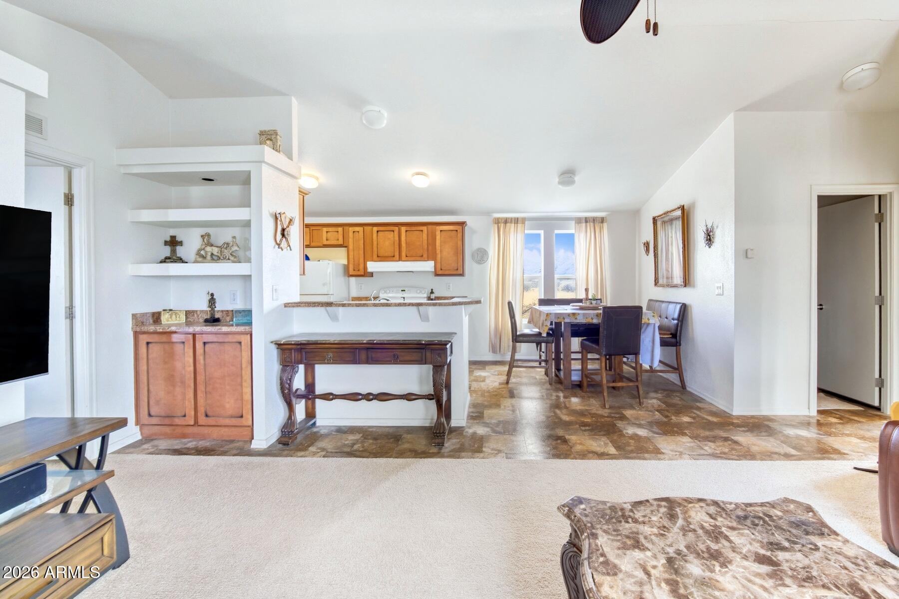 1250 North Fort Grant Road Willcox, AZ 85643 - Photo 10 of 33 a living room with furniture and a fireplace
