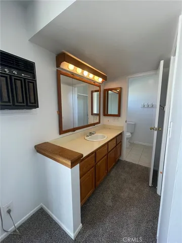 a utility room with a sink a washer and dryer