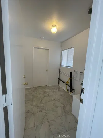 a view of room with a sink and mirror