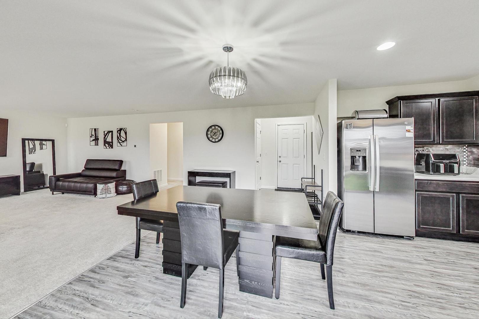 1014 Sharp Drive Plano, IL 60545 - Photo 12 of 52 a view of a dining room with furniture