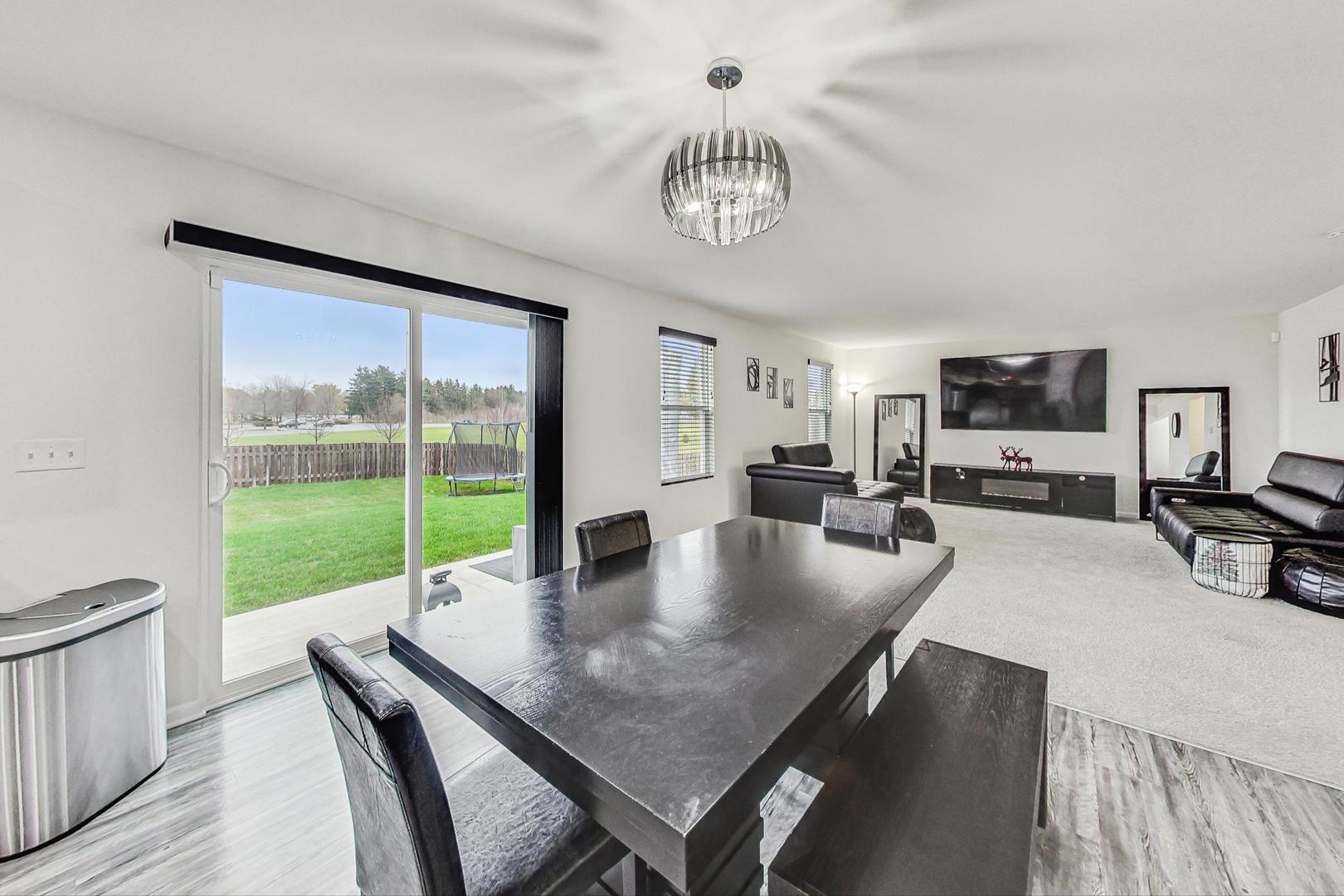 1014 Sharp Drive Plano, IL 60545 - Photo 13 of 52 a view of a dining room with furniture window and outside view