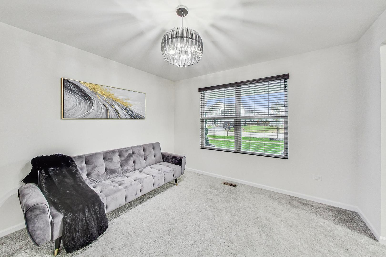 1014 Sharp Drive Plano, IL 60545 - Photo 18 of 52 a living room with furniture and a large window