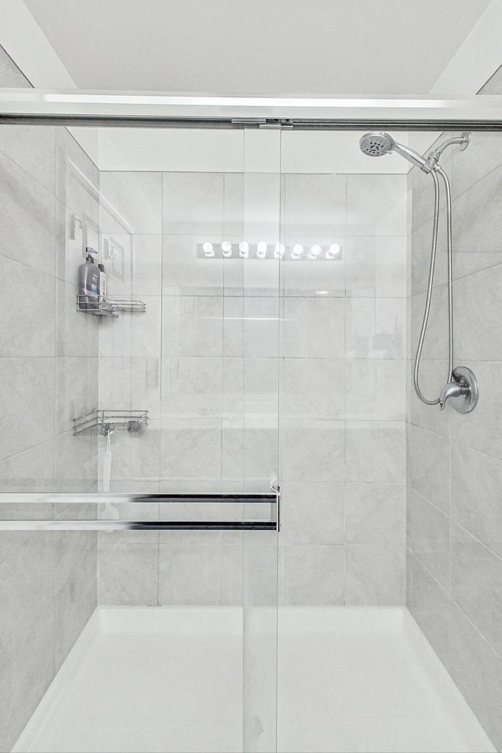 1014 Sharp Drive Plano, IL 60545 - Photo 27 of 52 a bathroom with a shower