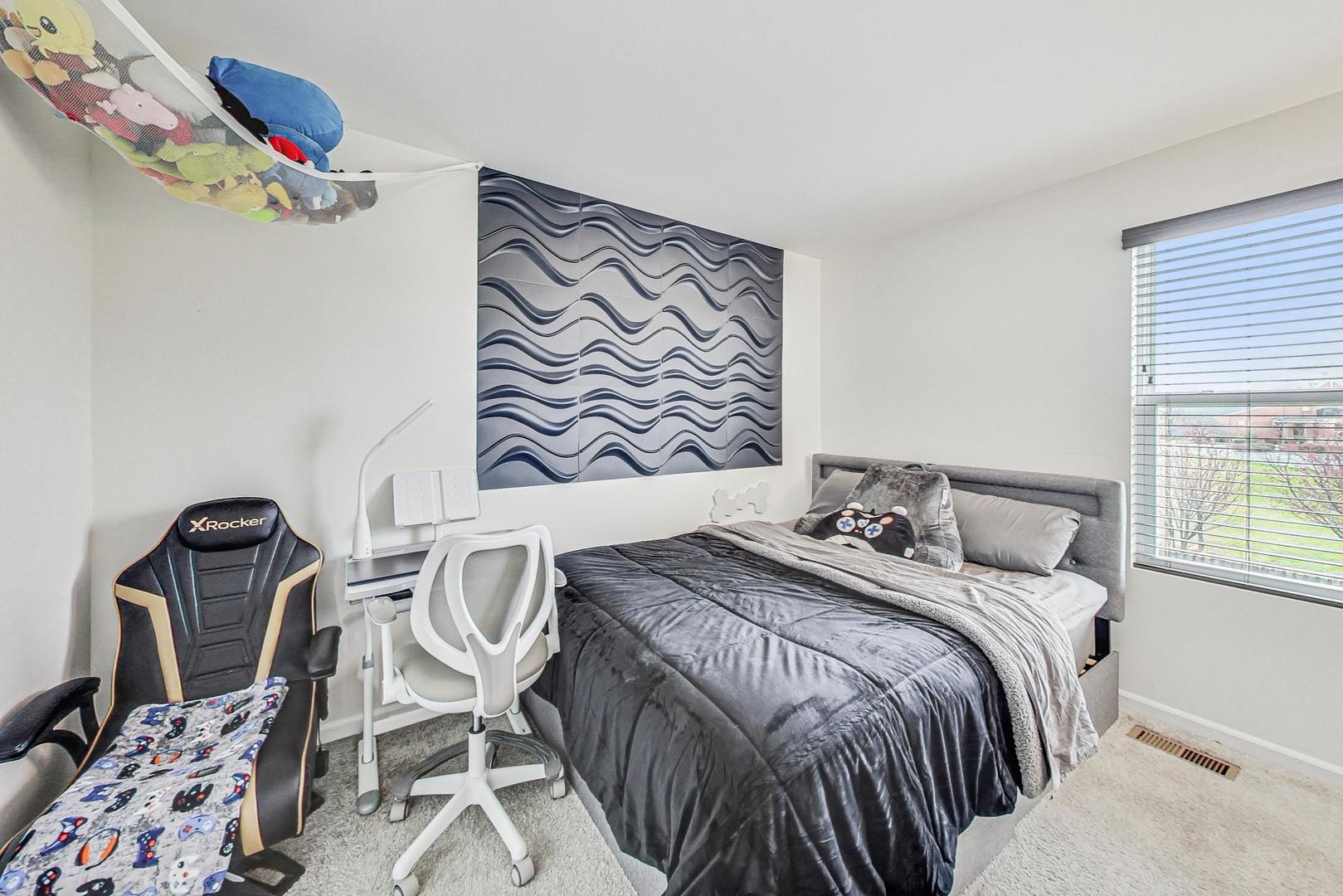 1014 Sharp Drive Plano, IL 60545 - Photo 30 of 52 a bedroom with a bed and a window