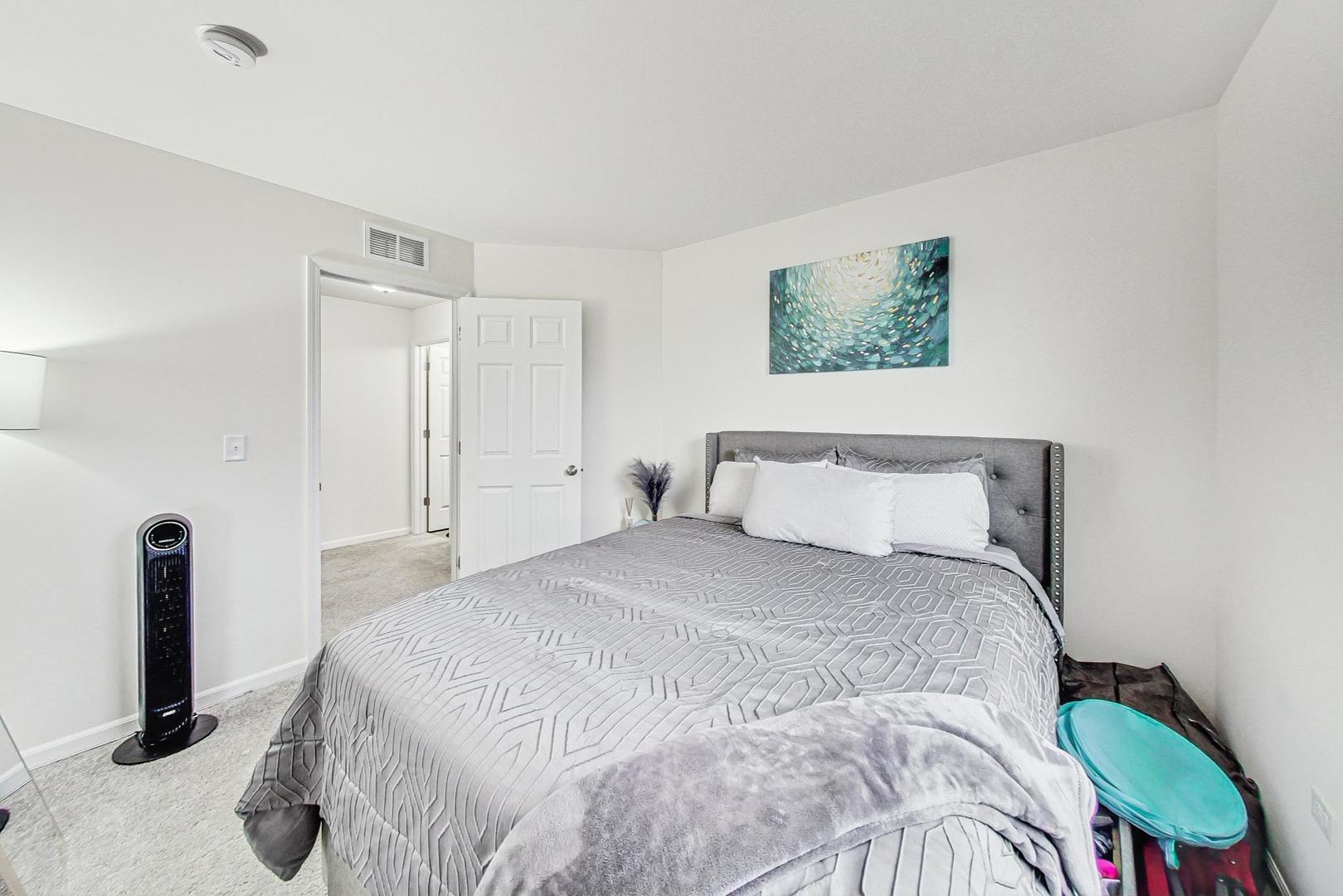 1014 Sharp Drive Plano, IL 60545 - Photo 32 of 52 a bedroom with a bed and a window