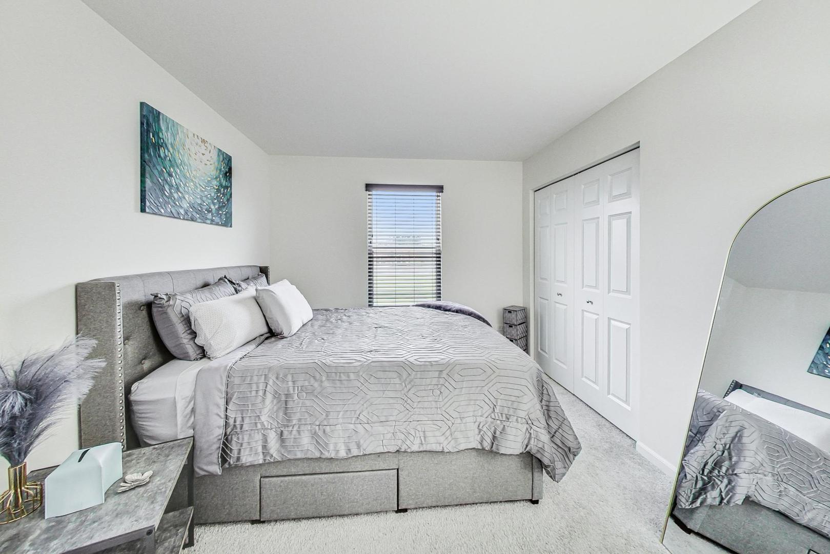 1014 Sharp Drive Plano, IL 60545 - Photo 33 of 52 a bedroom with a bed and a couch