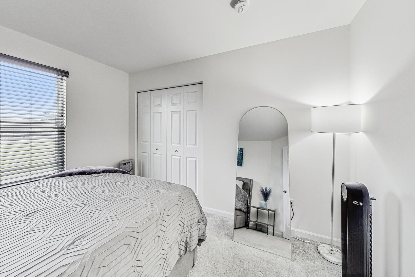 1014 Sharp Drive Plano, IL 60545 - Photo 34 of 52 a bedroom with a bed and a mirror