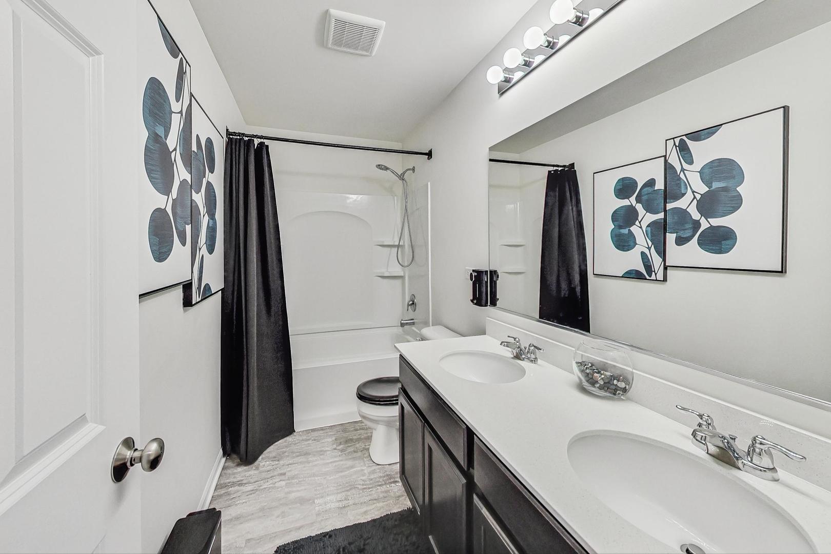 1014 Sharp Drive Plano, IL 60545 - Photo 37 of 52 a bathroom with a sink and a mirror