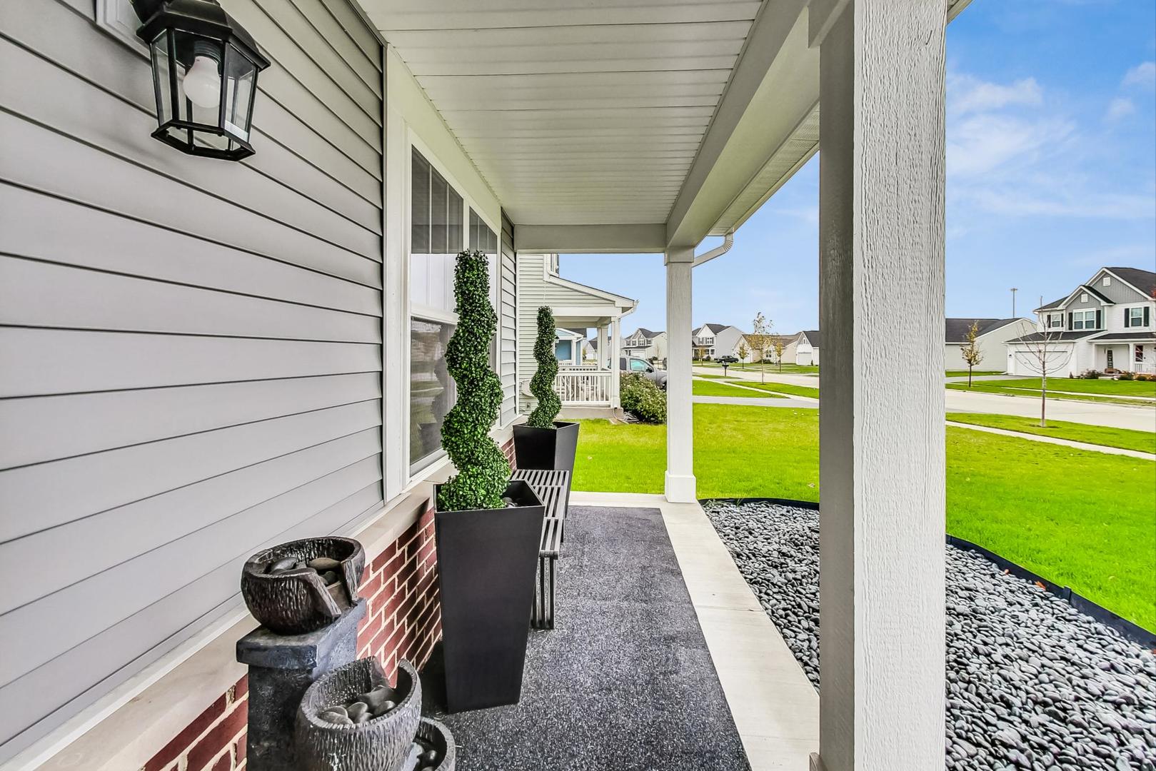 1014 Sharp Drive Plano, IL 60545 - Photo 4 of 52 a view of a porch with furniture