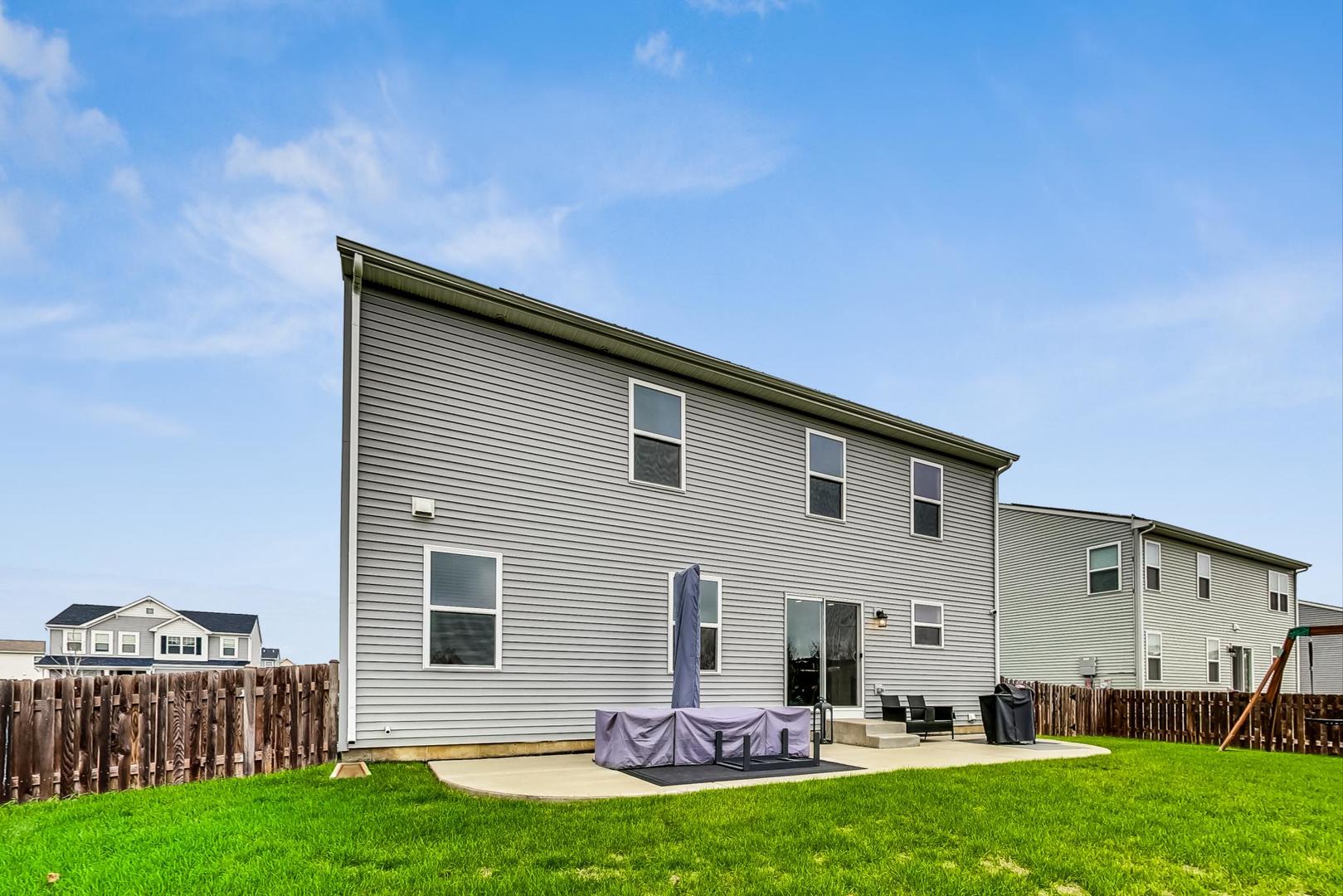 1014 Sharp Drive Plano, IL 60545 - Photo 43 of 52 a front view of house with yard