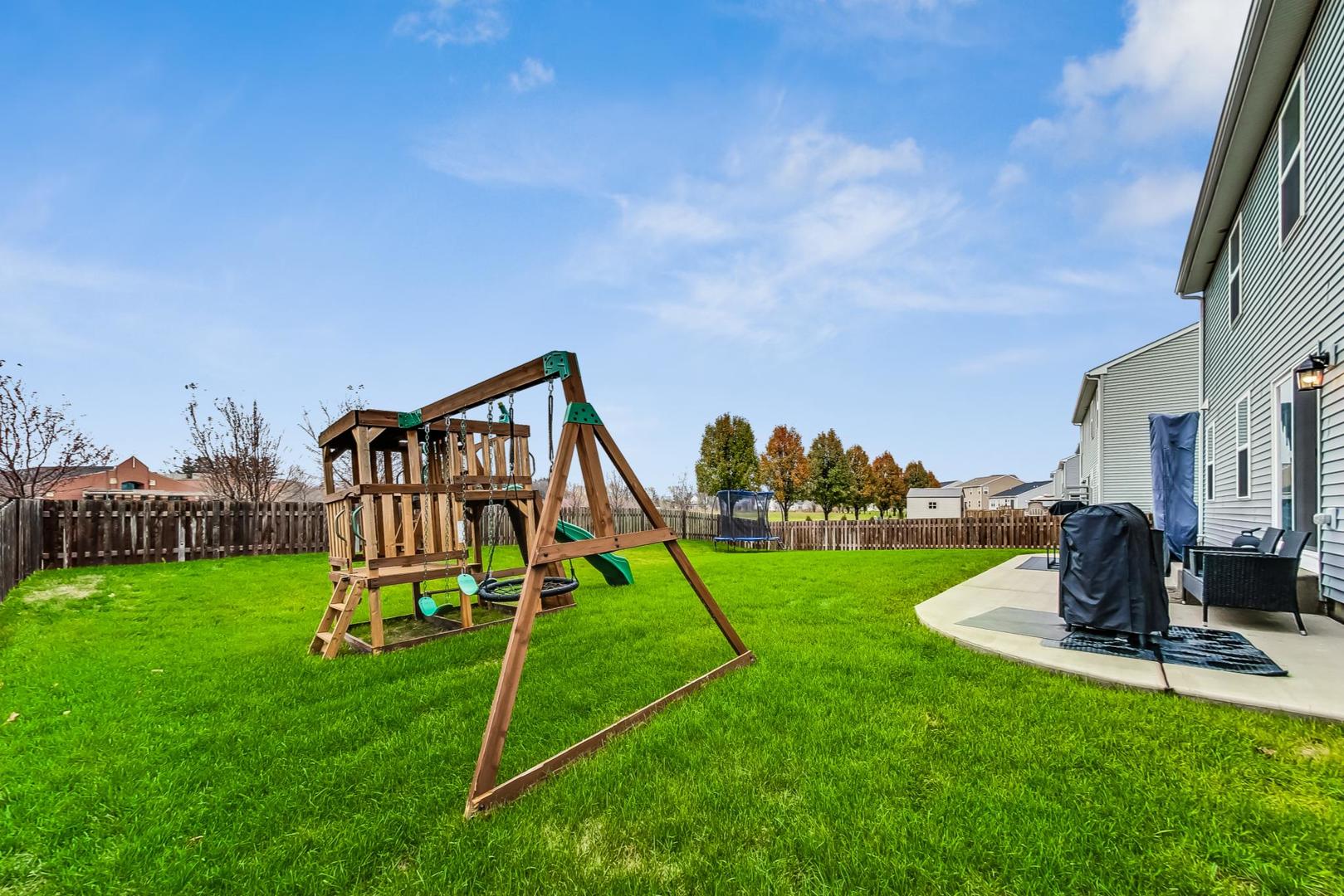 1014 Sharp Drive Plano, IL 60545 - Photo 46 of 52 a garden with trees in front of it