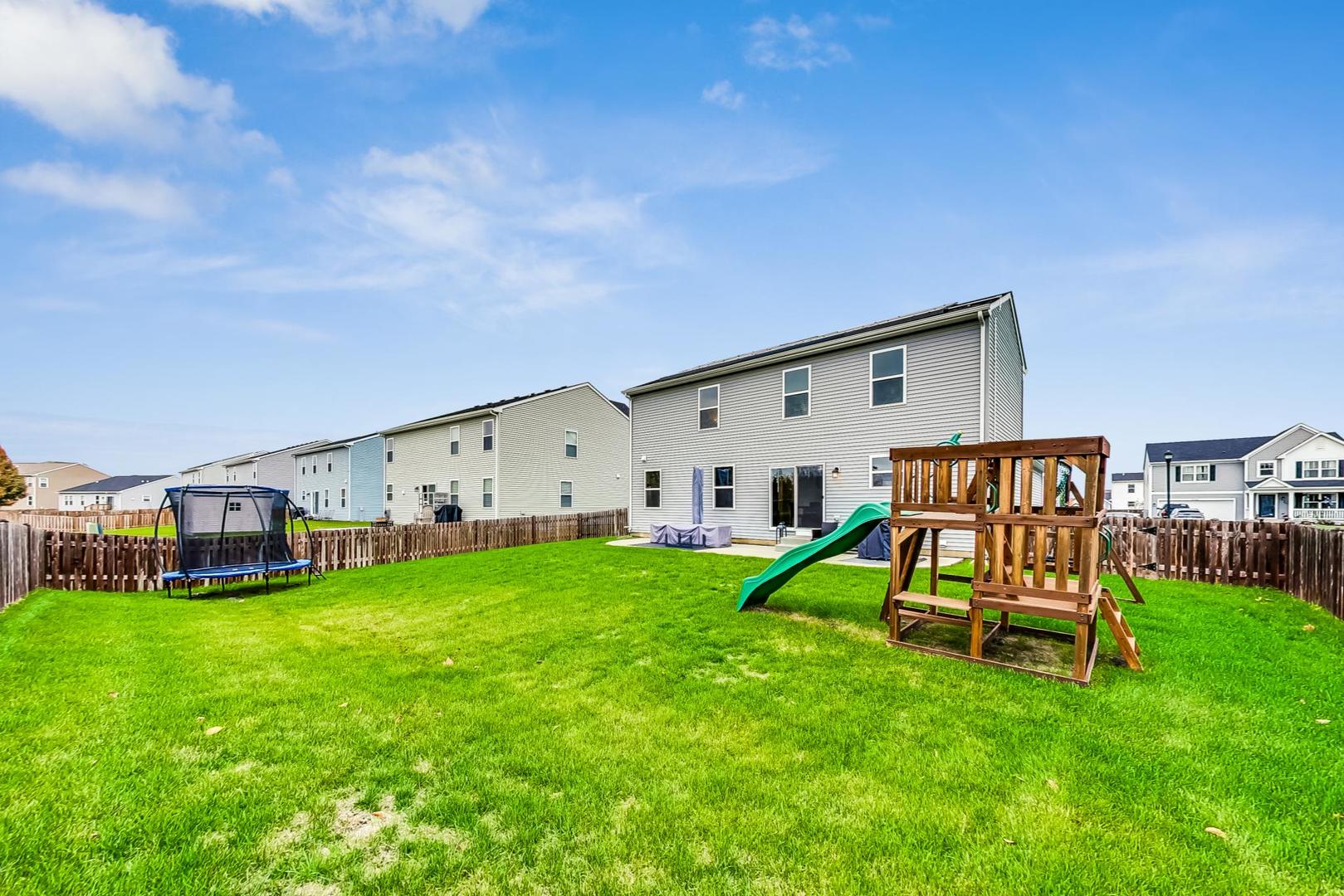 1014 Sharp Drive Plano, IL 60545 - Photo 47 of 52 a view of a house with a yard porch and sitting area