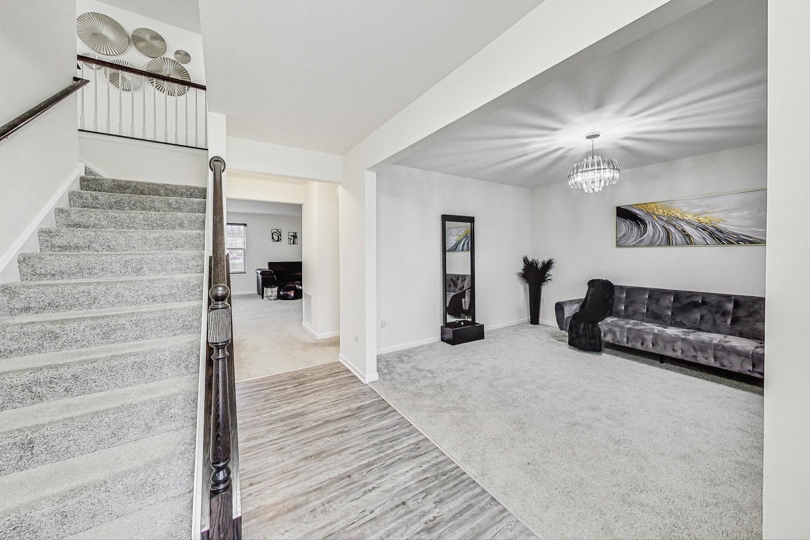 1014 Sharp Drive Plano, IL 60545 - Photo 7 of 52 a view of a bedroom with a bed and hallway