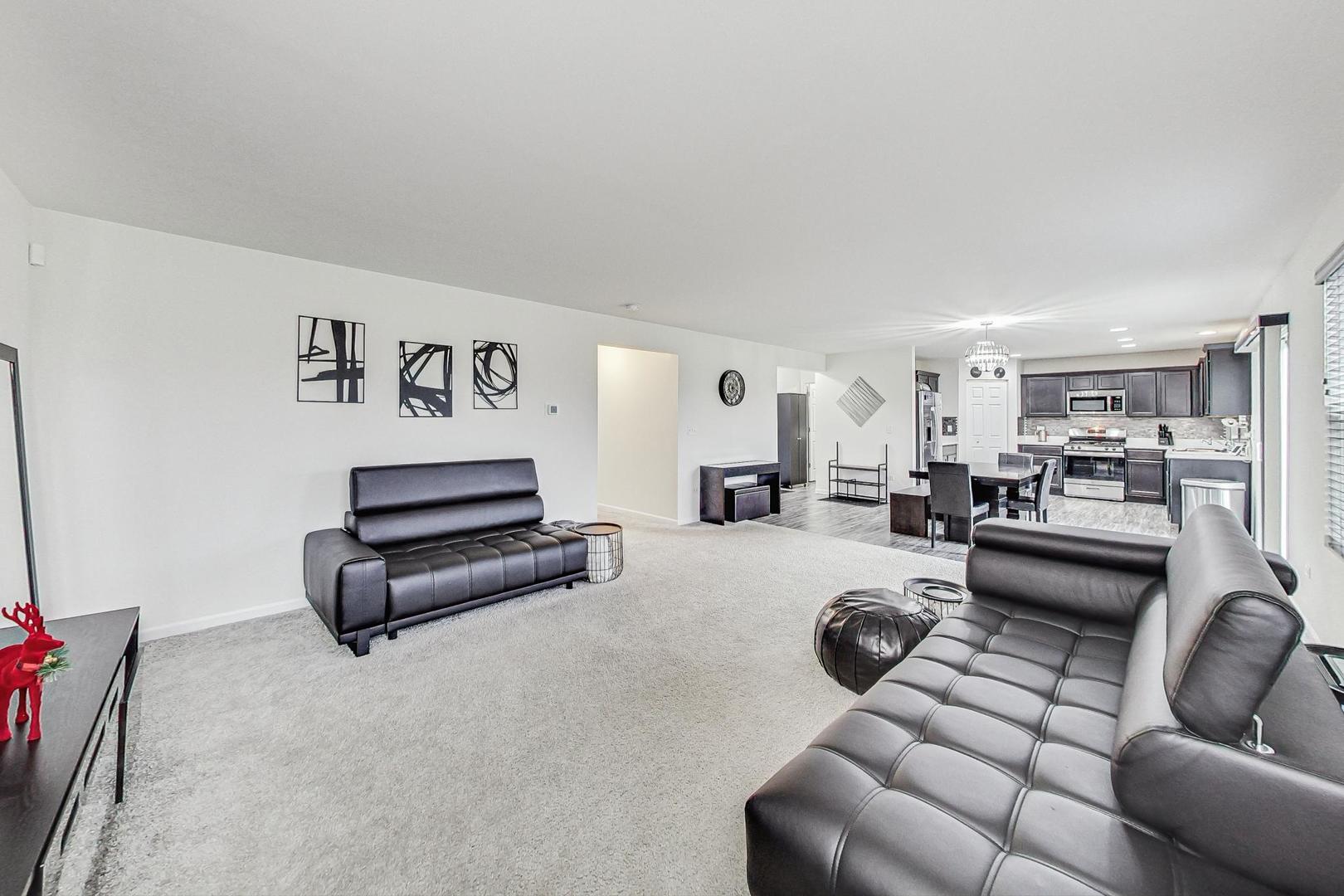 1014 Sharp Drive Plano, IL 60545 - Photo 9 of 52 a living room with furniture