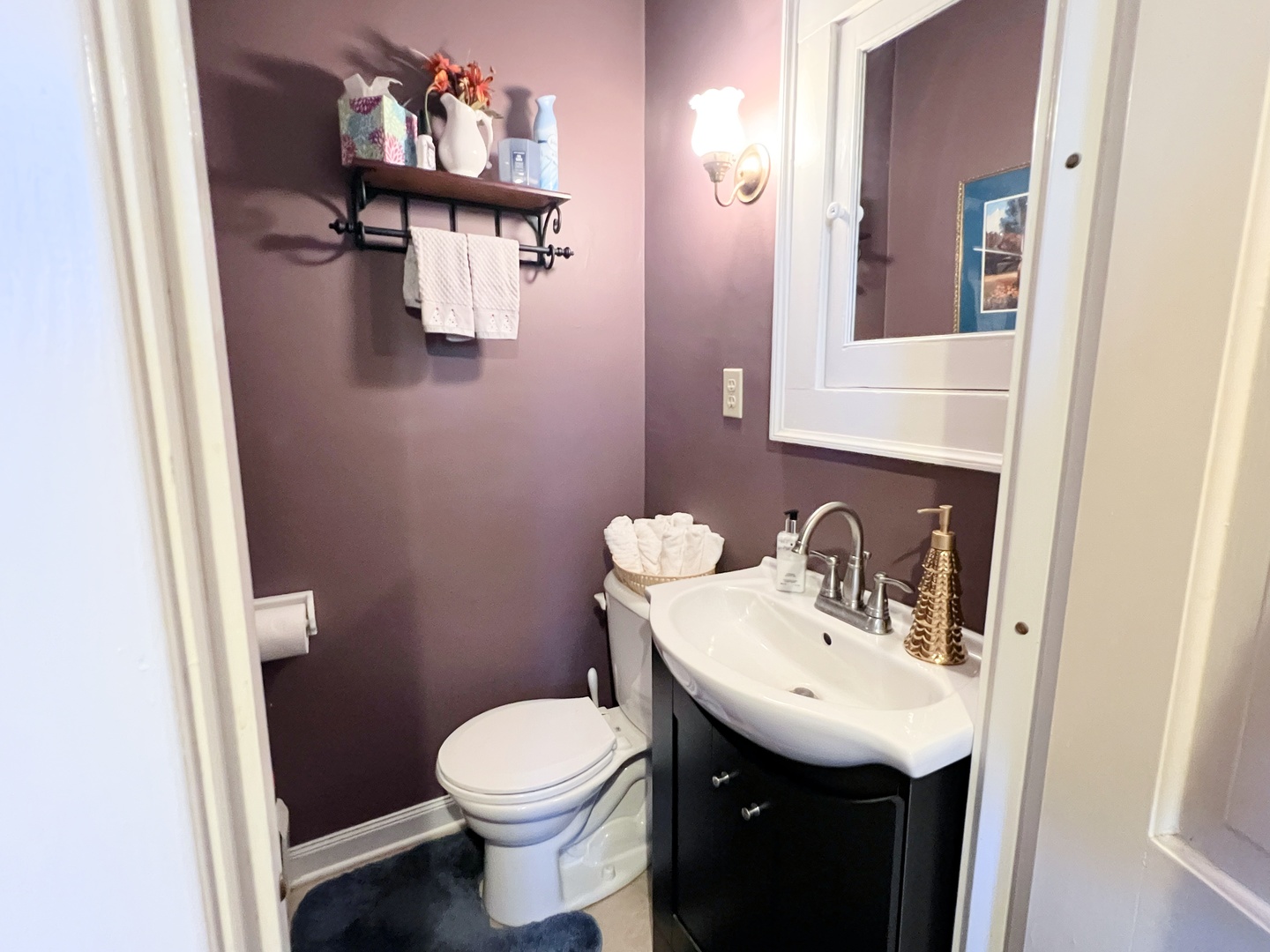2037 Clinton Street Rockford, IL 61103 - Photo 13 of 27 a bathroom with a sink toilet and mirror