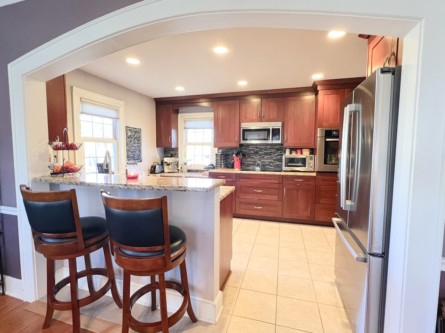 2037 Clinton Street Rockford, IL 61103 - Photo 5 of 27 a kitchen with a table chairs refrigerator and cabinets
