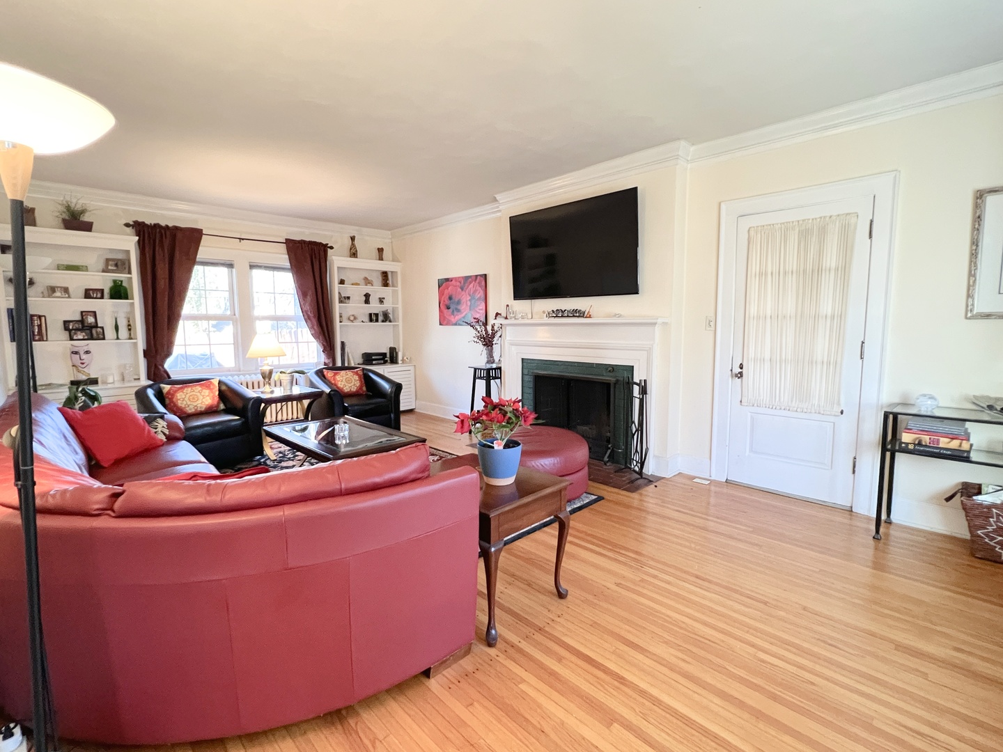 2037 Clinton Street Rockford, IL 61103 - Photo 10 of 27 a living room with furniture a fireplace and a flat screen tv