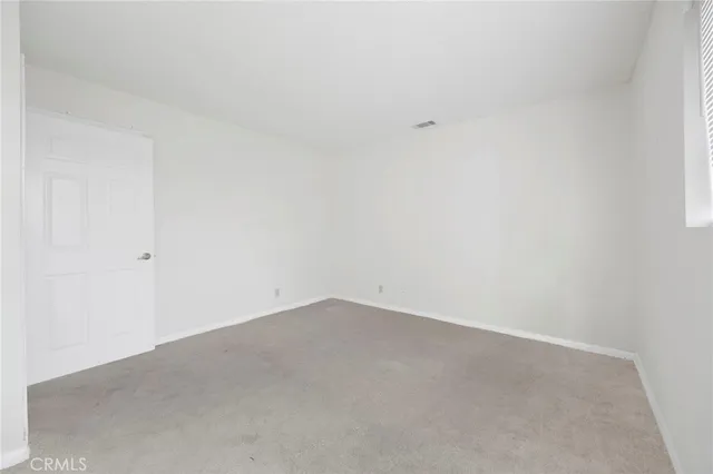 front view of a house with potted plants