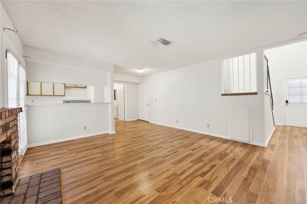 1835 South Alta Vista Avenue, Unit D Monrovia, CA 91016 - Photo 6 of 20 a view of empty room with wooden floor and window