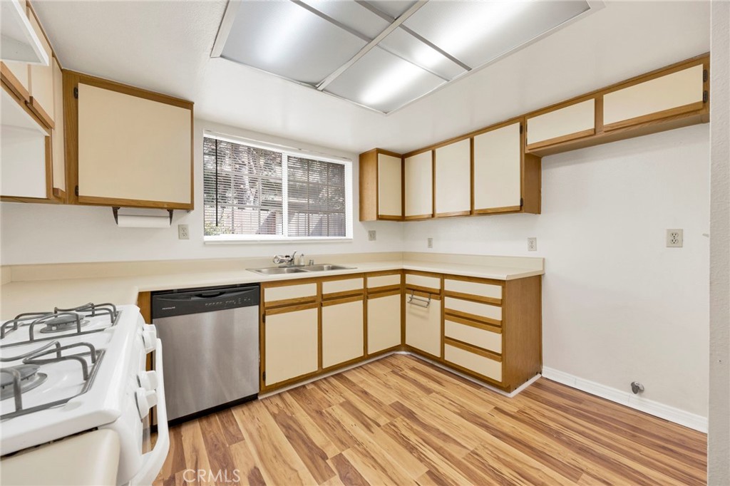 1835 South Alta Vista Avenue, Unit D Monrovia, CA 91016 - Photo 8 of 20 a kitchen with granite countertop white cabinets and white appliances