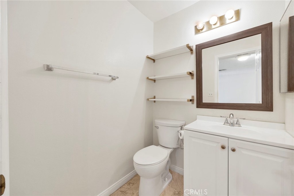 1835 South Alta Vista Avenue, Unit D Monrovia, CA 91016 - Photo 10 of 20 a bathroom with a toilet sink vanity and mirror