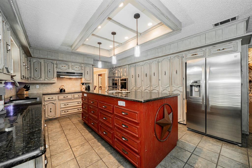 9511 Fallbrook Drive Dallas, TX 75243 - Photo 11 of 40 a kitchen with stainless steel appliances granite countertop a refrigerator and cabinets