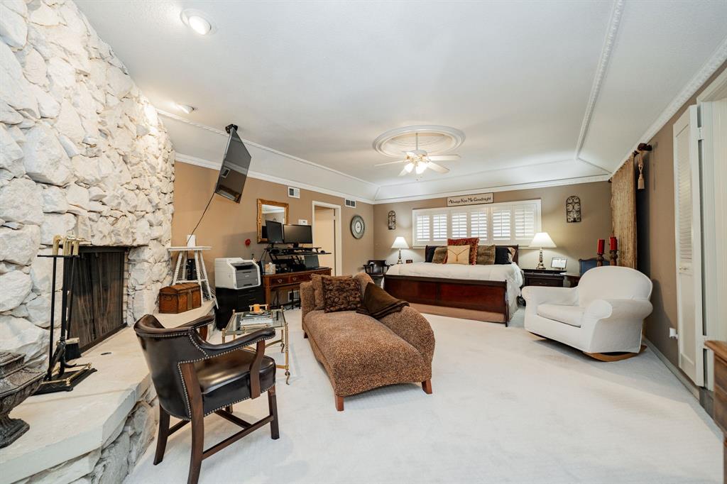 9511 Fallbrook Drive Dallas, TX 75243 - Photo 27 of 40 a living room with furniture and a fireplace
