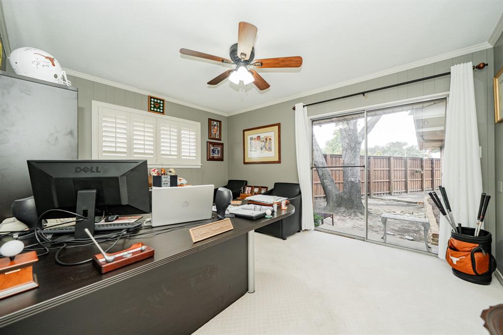 9511 Fallbrook Drive Dallas, TX 75243 - Photo 35 of 40 a living room with furniture a flat screen tv and a large window