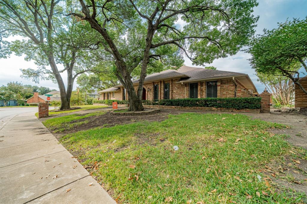 9511 Fallbrook Drive Dallas, TX 75243 - Photo 37 of 40 a front view of house with yard and green space