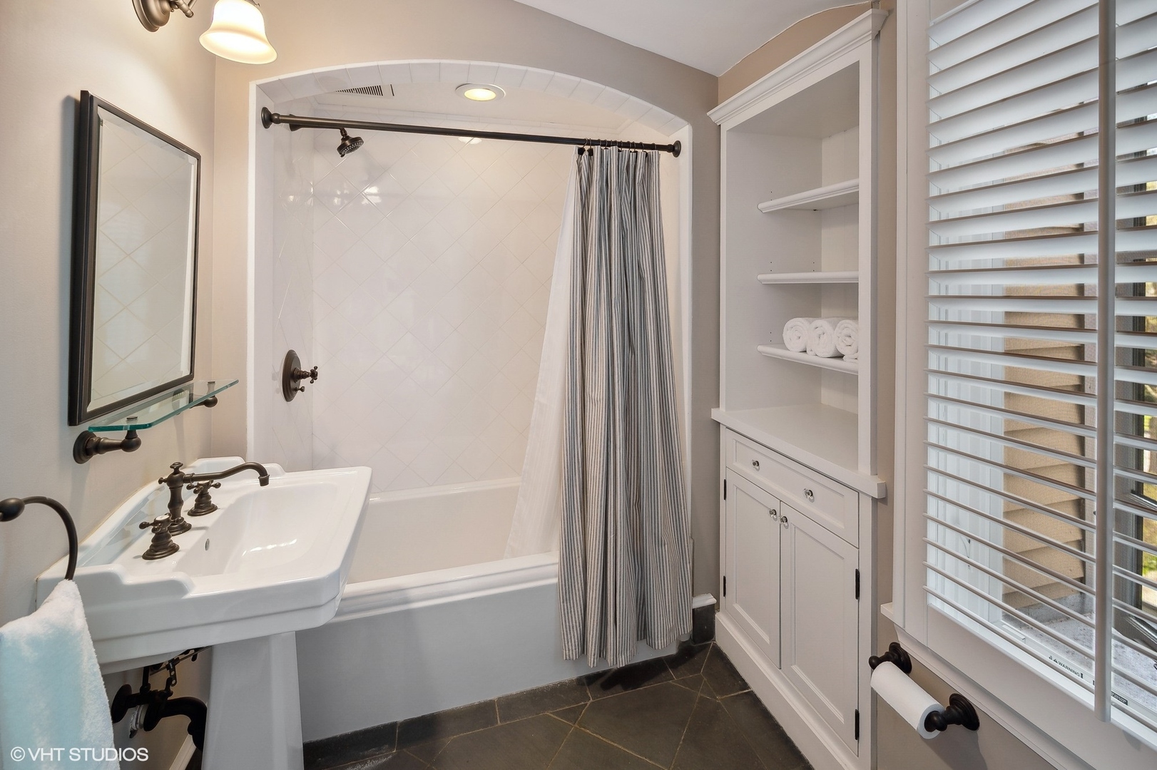 348 Sterling Road Kenilworth, IL 60043 - Photo 39 of 67 a bathroom with a sink and a mirror