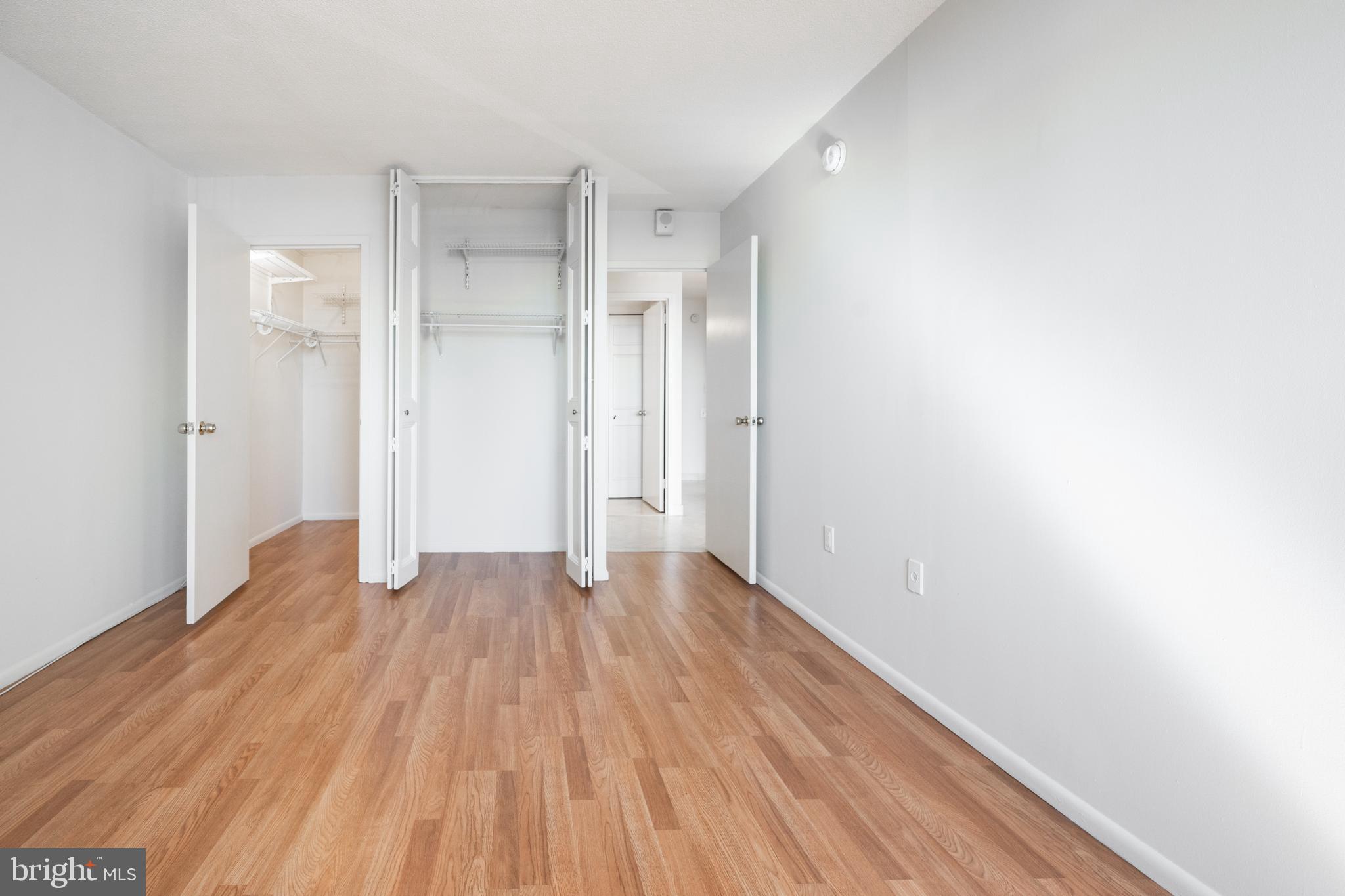 1420 Locust Street, Unit 24R Philadelphia, PA 19102 - Photo 19 of 31 a view of an empty room with wooden floor