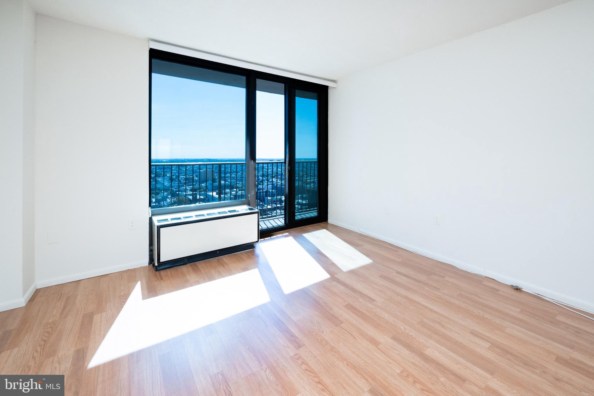 1420 Locust Street, Unit 24R Philadelphia, PA 19102 - Photo 7 of 31 a view of a room with wooden floor and shoes