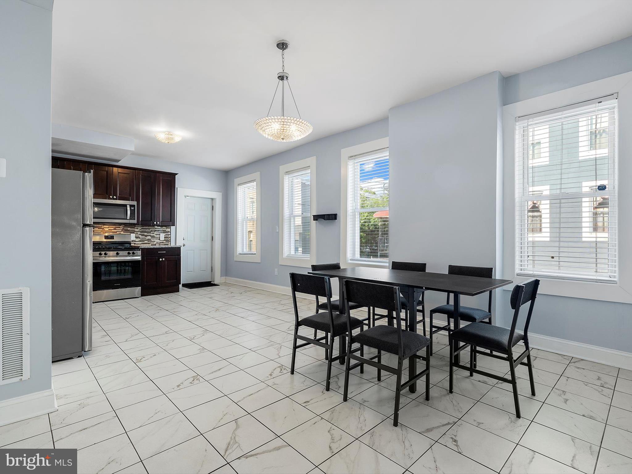 1713 East Lafayette Avenue Baltimore, MD 21213 - Photo 11 of 29 a view of a dining room with furniture