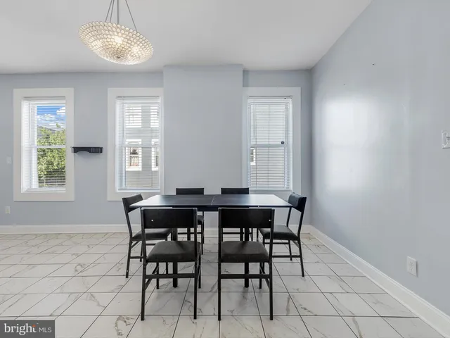 a view of a dining room with furniture and window