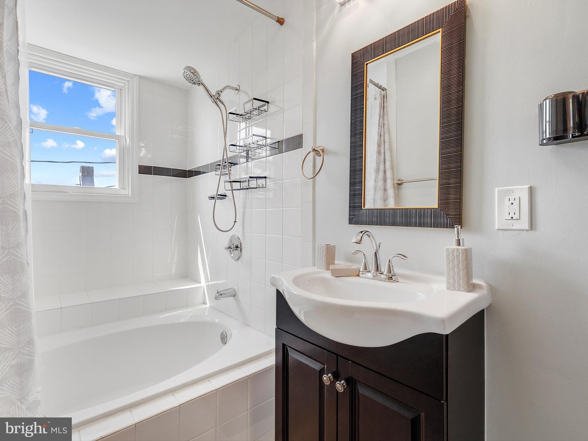 1713 East Lafayette Avenue Baltimore, MD 21213 - Photo 21 of 29 a bathroom with a sink mirror toilet and bathtub