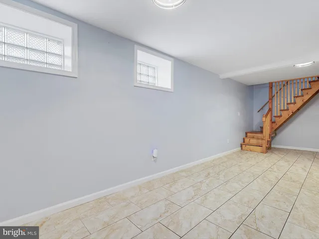 a view of an empty room with stairs