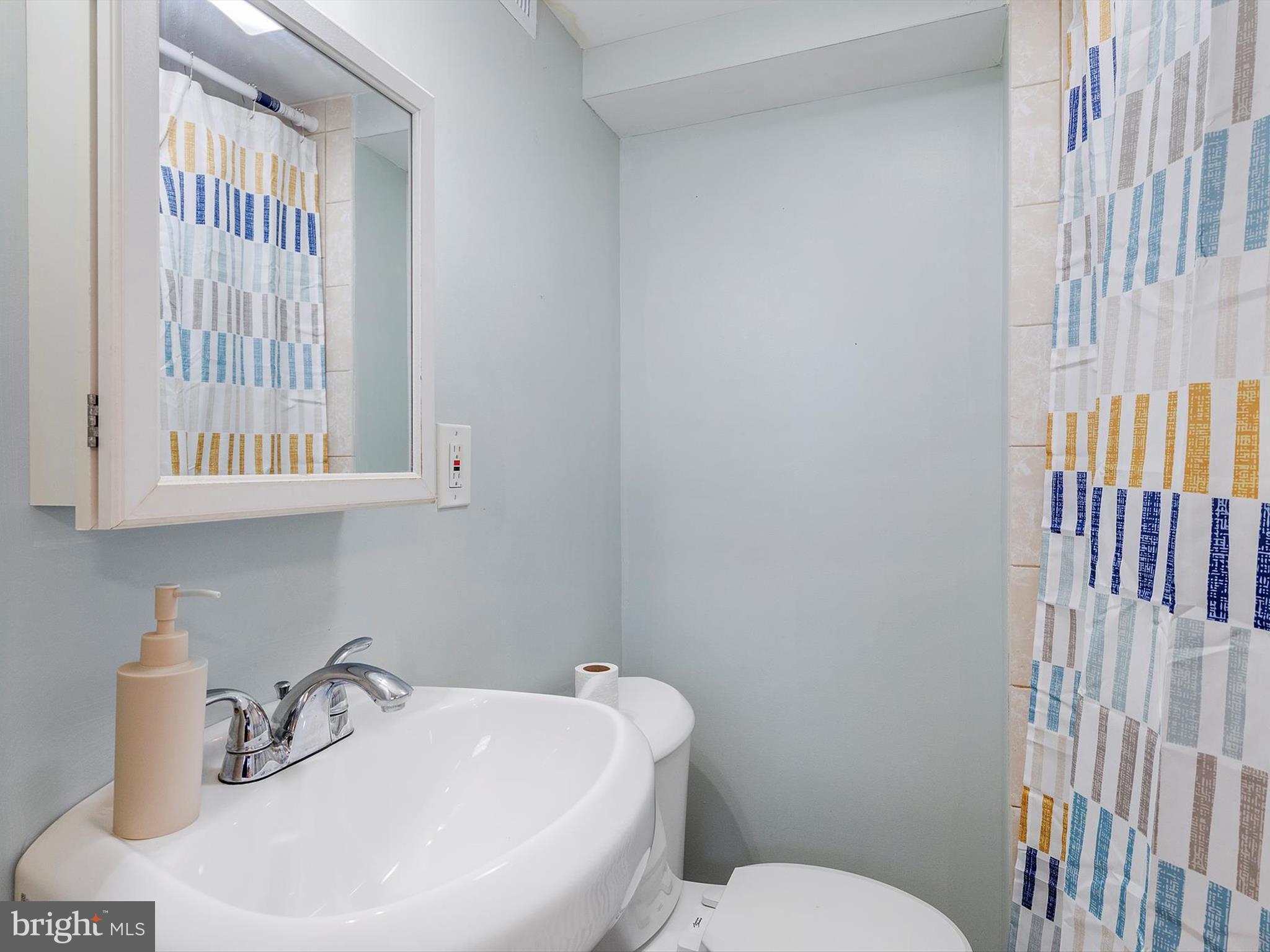 1713 East Lafayette Avenue Baltimore, MD 21213 - Photo 26 of 29 a bathroom with a sink and a toilet
