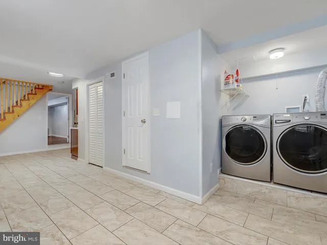 a view of a storage & utility room with washer and dryer