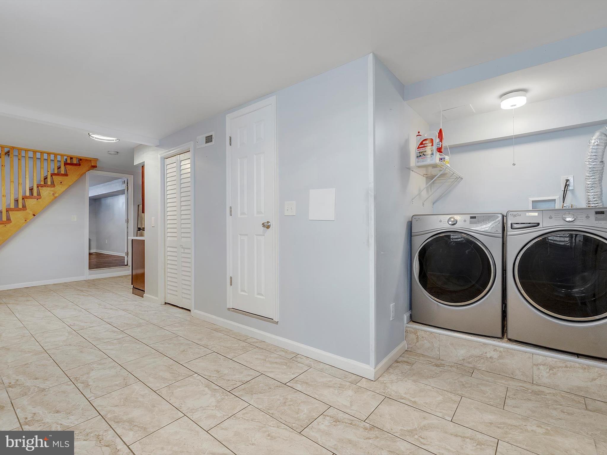 1713 East Lafayette Avenue Baltimore, MD 21213 - Photo 27 of 29 a view of a storage & utility room with washer and dryer