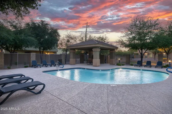 a view of a swimming pool with a patio