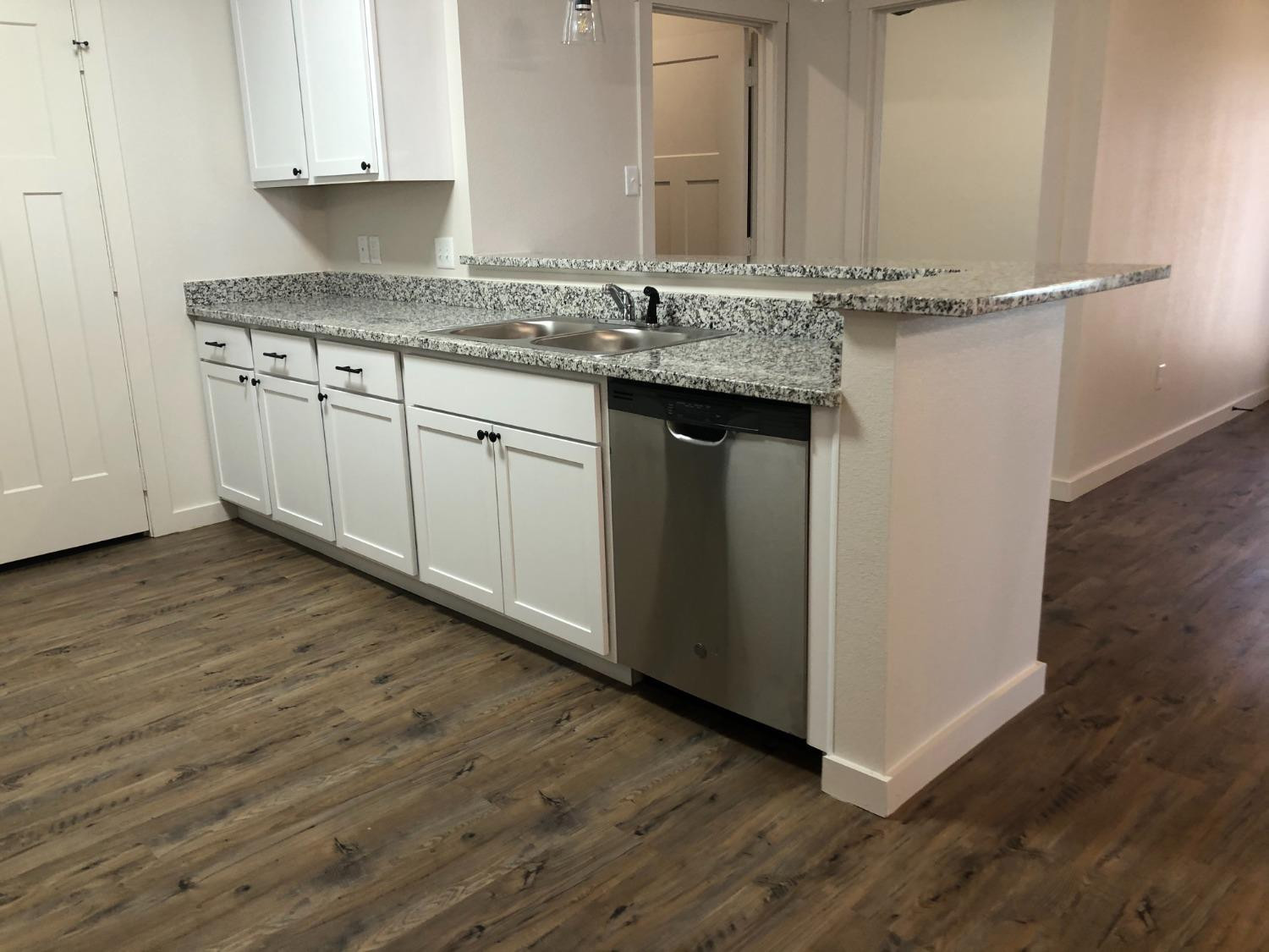 2723 137th Street Lubbock, TX 79423 - Photo 4 of 19 a kitchen with a sink and cabinets